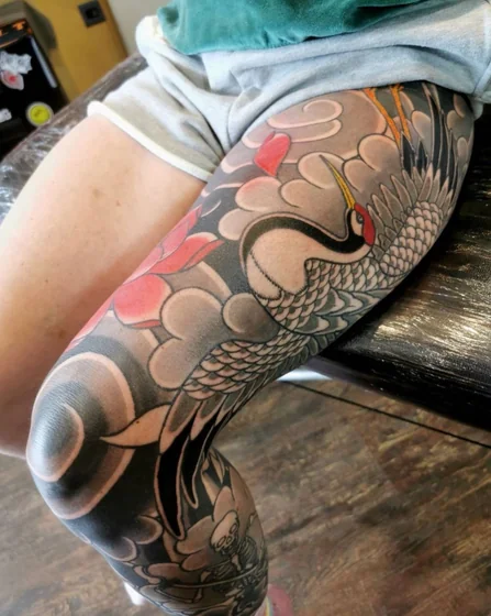 Japanese Traditional crane and floral tattoo idea for women on leg