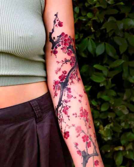 Japanese cherry blossom floral tattoo design for women on forearm