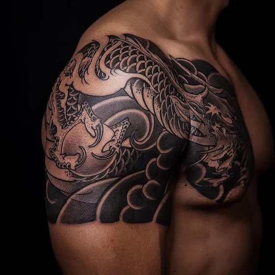 Japanese dragon with dragon pearl tattoo idea for men on shoulder