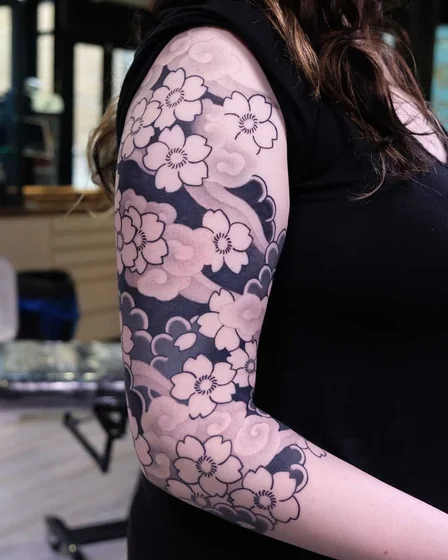 Japanese floral and cloud half sleeve tattoo idea for women