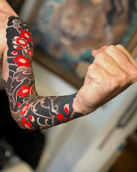 Japanese floral full sleeve tattoo idea for men on arm
