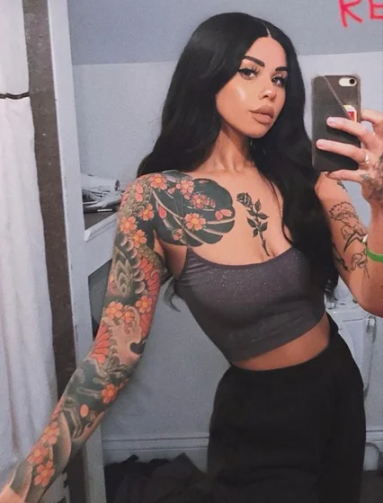 Japanese floral sleeve and blackwork rose tattoo idea for women