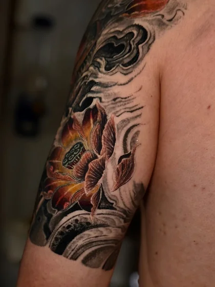 Japanese lotus flower tattoo design for men on upper arm
