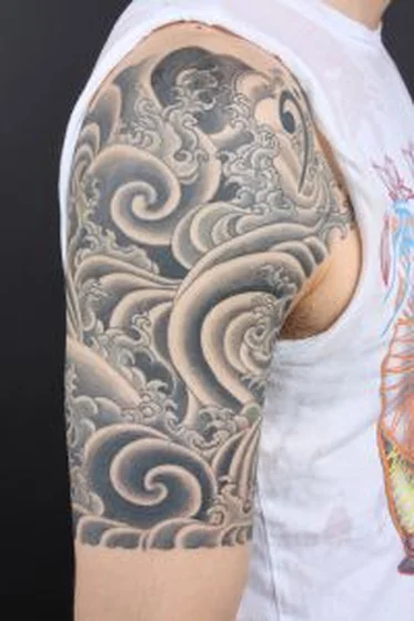 Japanese ocean waves tattoo design for men on half sleeve