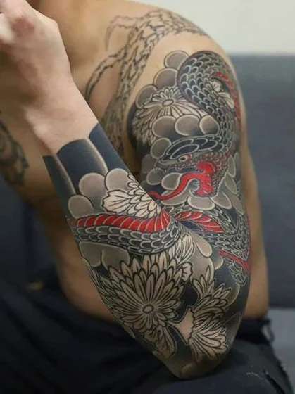 Japanese snake and floral tattoo design for men on forearm and upper arm