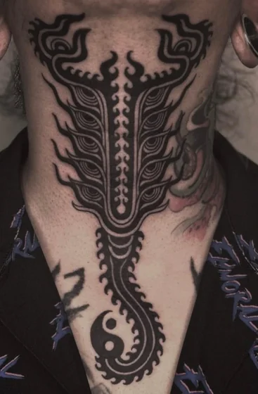 Men's Blackwork Tribal Yin Yang Eye Motif neck and sternum tattoo.