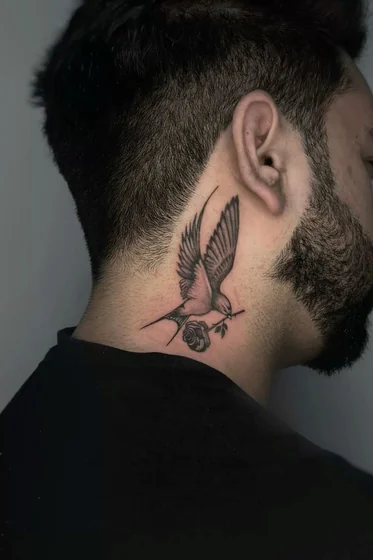 Men's Neo-Traditional black and grey swallow and rose tattoo