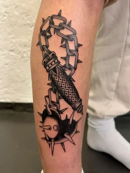 Men's Traditional Blackwork spiked chain & heart tattoo on calf