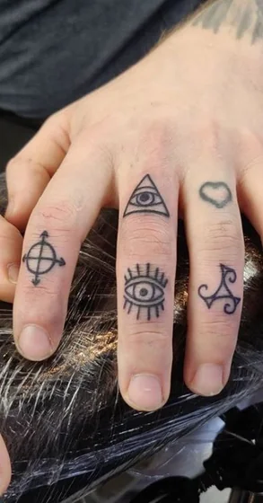 Men's patchwork fine line eye, heart, directional symbol finger tattoos idea