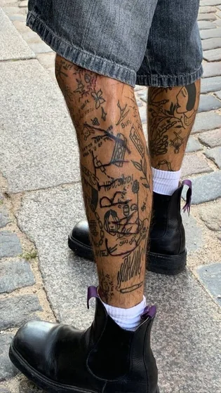 Men's patchwork ignorant style flower, butterfly leg tattoo idea.