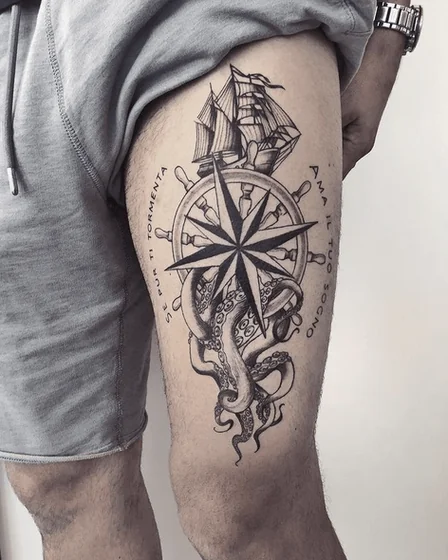 Men's realistic black and grey nautical octopus thigh tattoo.
