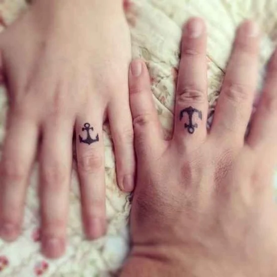 Minimalist Anchor tattoo idea for men & women on hand finger
