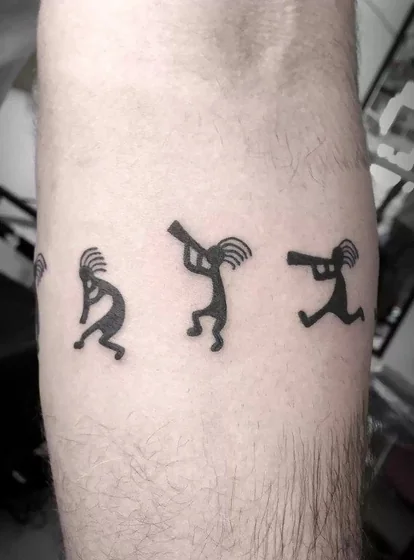 Minimalist Blackwork Native American Kokopelli tattoo design for men on forearm