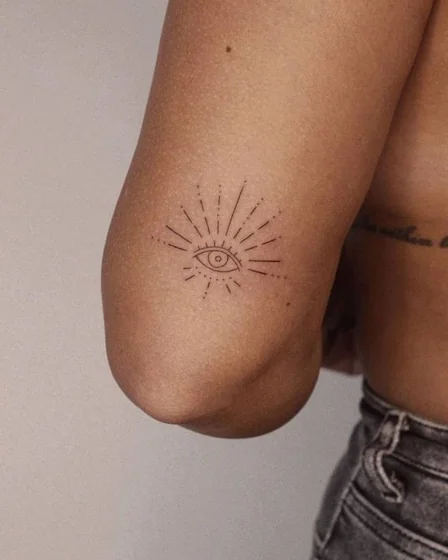 Minimalist Fine Line All-Seeing Eye tattoo for women on elbow