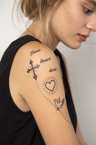 Minimalist Fine Line Cross Heart Dove tattoo for women on shoulder