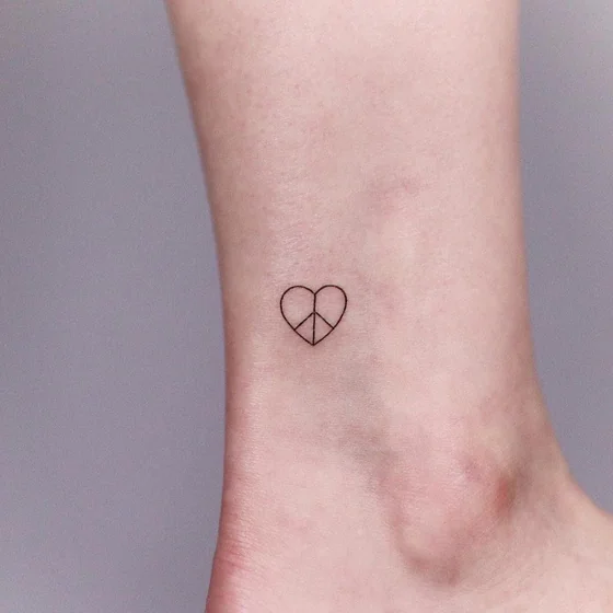 Minimalist Fine Line Heart Peace Sign tattoo for women on Ankle