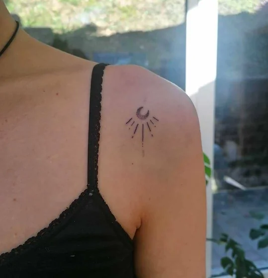 Minimalist Fine Line Moon and Sun tattoo design for women on shoulder