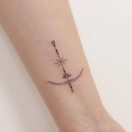 Minimalist Fine Line Sagittarius arrow tattoo design for women