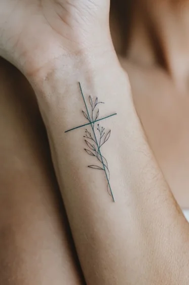 Minimalist Fine Line floral cross tattoo design for women on wrist