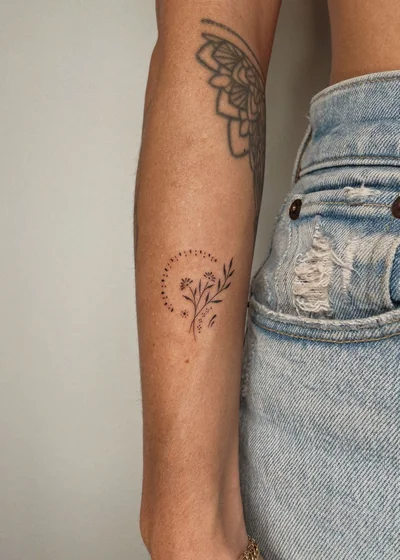 Minimalist Floral Fine Line tattoo for women on forearm