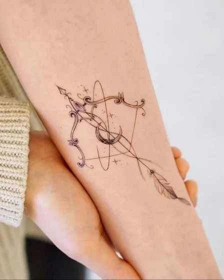 Minimalist Sagittarius Moon Feather tattoo idea for women on forearm