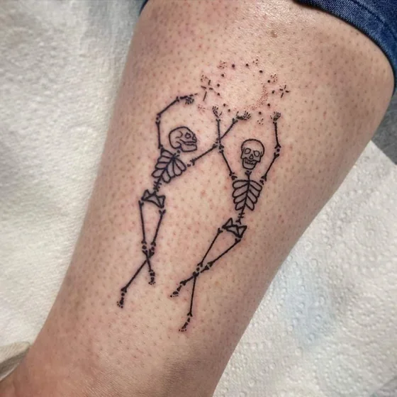 Minimalist Skeleton and Star tattoo idea for men & women on calf
