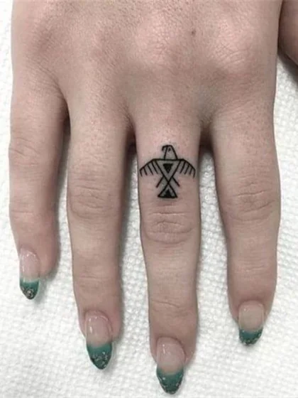 Minimalist Tribal Thunderbird tattoo idea for ladies on finger