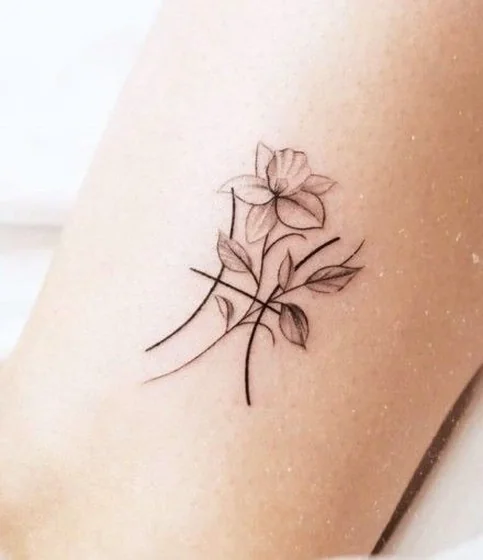 Minimalist fine line floral tattoo design for women on forearm