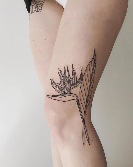 Minimalist fine line flower floral tattoo idea for women on thigh