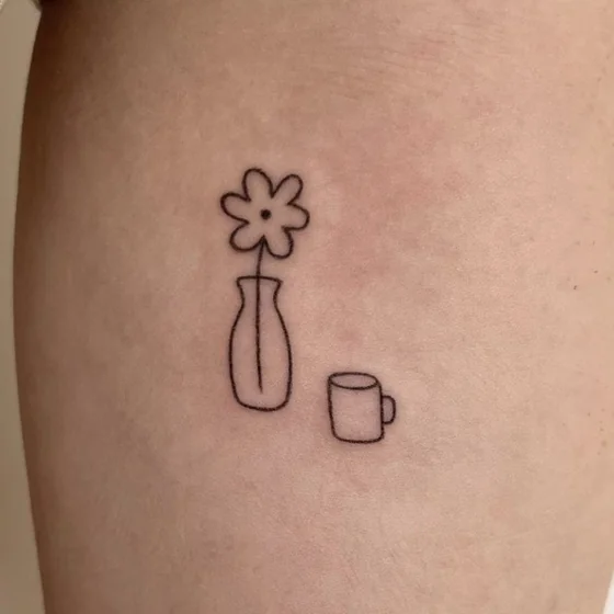 Minimalist fine line flower in vase and mug tattoo idea for women on arm