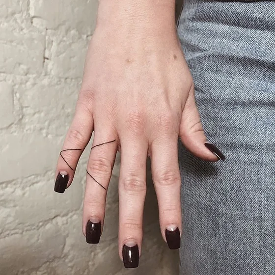 Minimalist fine line geometric lines tattoo idea for women on hand