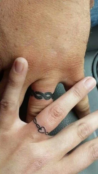 Minimalist fine line infinity heart and knot ring tattoo design for men, women on finger