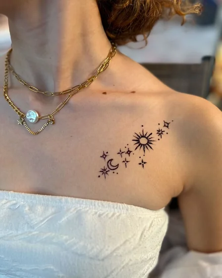 Minimalist fine line sun, moon, star tattoo design for women on shoulder