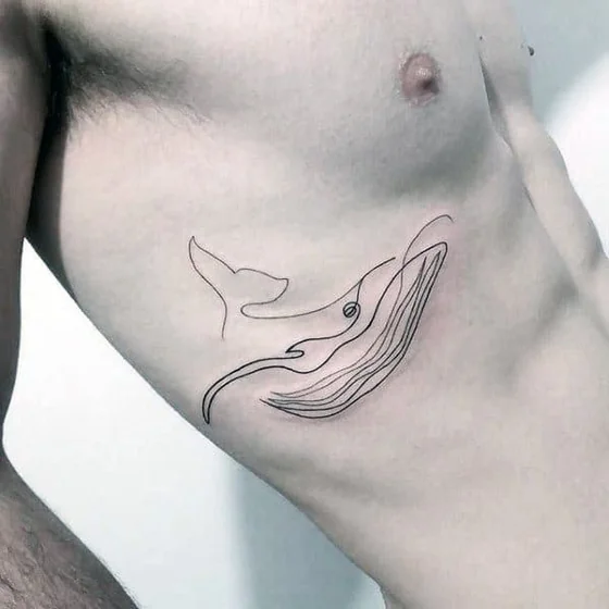 Minimalist fine line whale and ocean tattoo design for men on rib