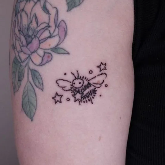 Minimalist linework bee, star, flower tattoo idea for ladies on upper arm