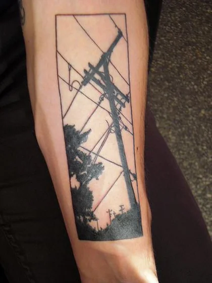 Minimalist utility pole and tree forearm tattoo for men and women