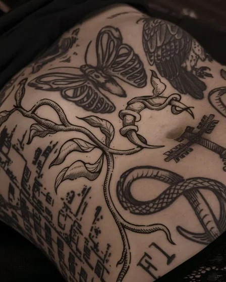 Neo-Traditional Blackwork animal tattoo idea for women on rib.