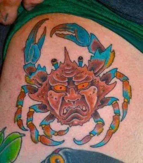 Neo-Traditional Cancer tattoo idea for men on thigh