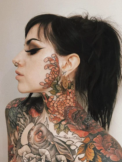Neo-Traditional Japanese floral tattoo for women on face, neck