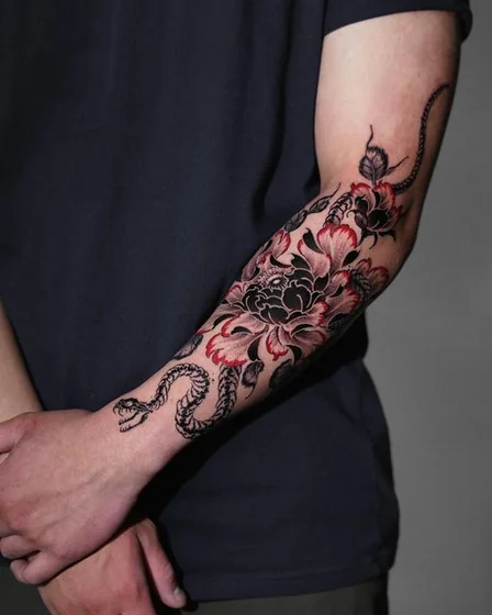 Neo-Traditional Japanese snake and floral tattoo design for men on forearm