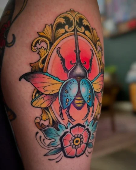 Neo-Traditional beetle and floral tattoo design for men and women on upper arm