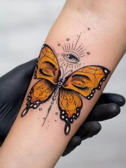 Neo-Traditional butterfly with all-seeing eye tattoo design for women on forearm
