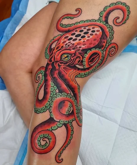 Neo-Traditional octopus tattoo idea for women on thigh and knee