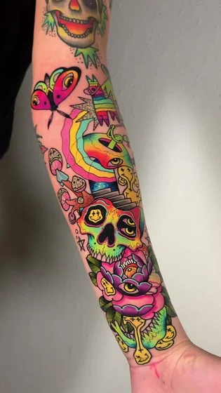 New School Patchwork skull, flower, butterfly, mushroom tattoo idea for men & women on forearm