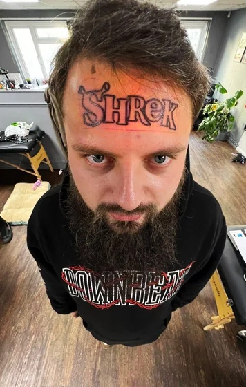 New School Shrek word tattoo idea for men on face tattoo ideas