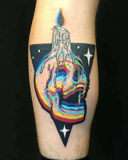 New School glitch art skull and candle tattoo design for men on calf