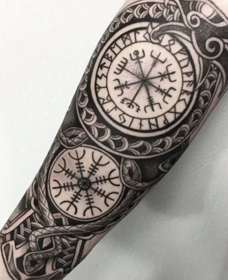 Nordic Blackwork Compass & Aegishjalmur tattoo idea for men & women on forearm.