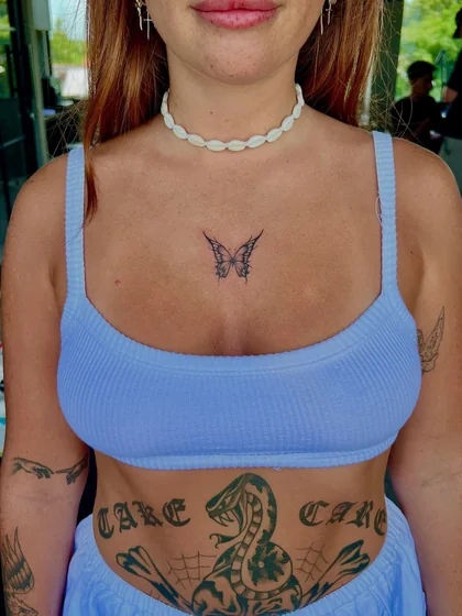 Patchwork Blackwork butterfly, snake, word tattoo idea for women.