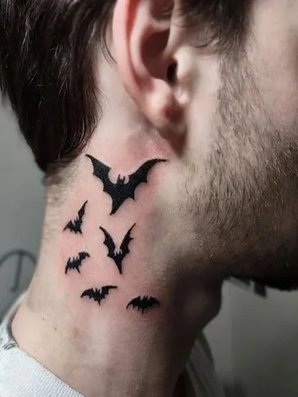 Patchwork blackwork bat tattoo for men on neck and behind ear