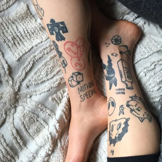 Patchwork ignorant style alien, skull, dice, thunderbird tattoo design for women on calf and ankle.